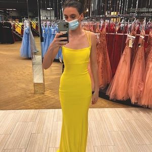 Yellow mermaid prom dress, tight and backless.